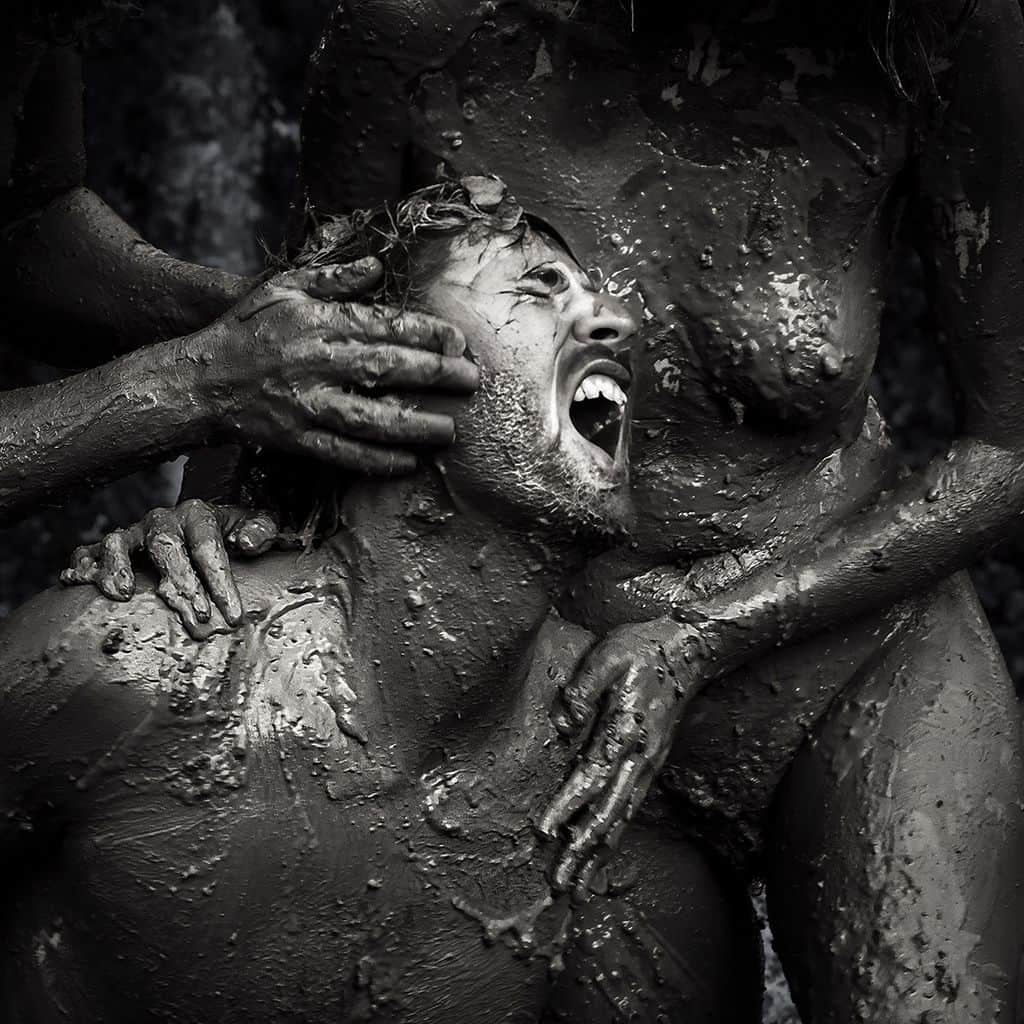 Johan scream as clay-covered hands reach toward him